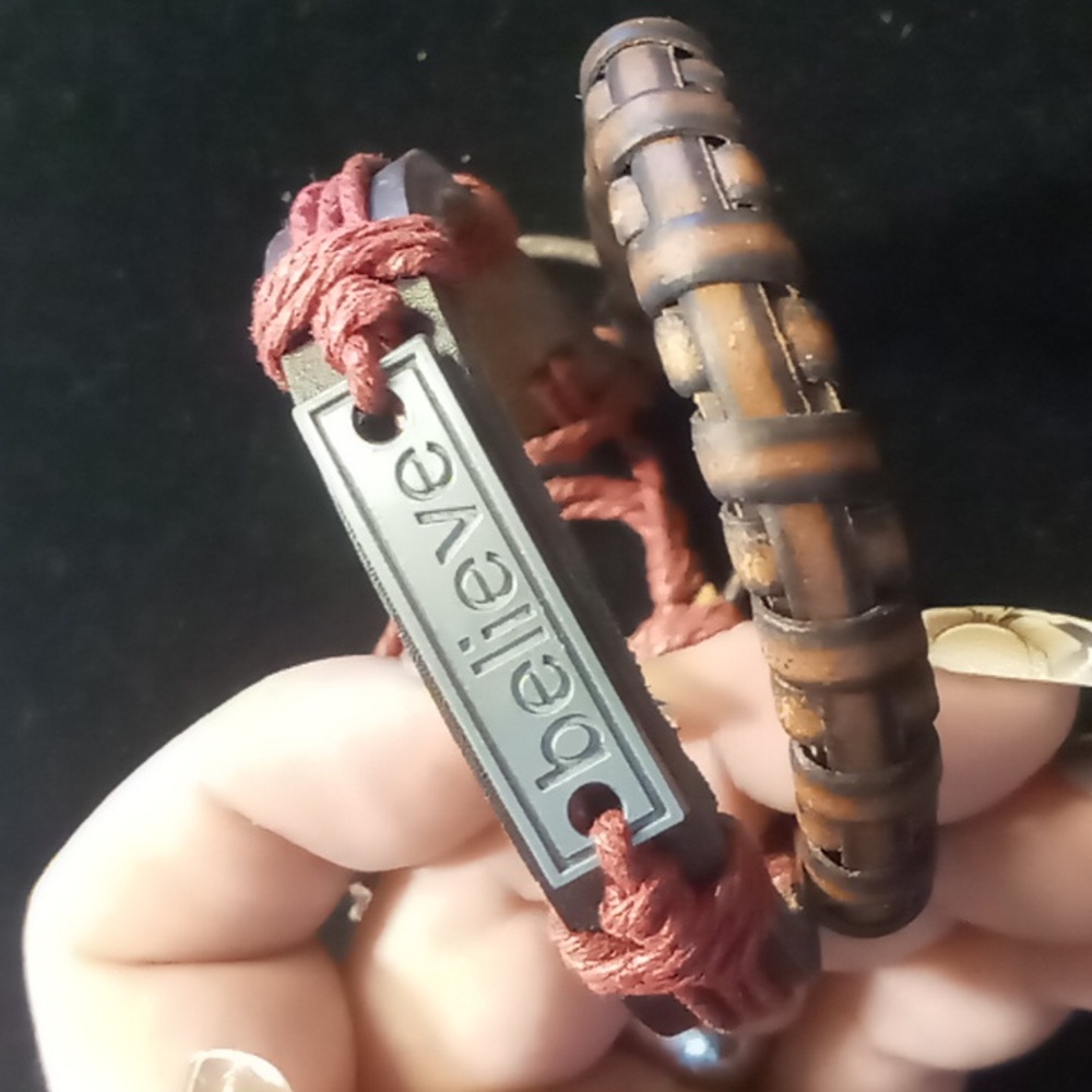 Genuine leather slide bracelet with inspirational believe pendant .